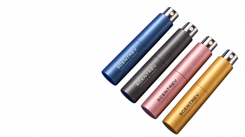 scentRev travel atomizers in blue, graphite, rose, and gold